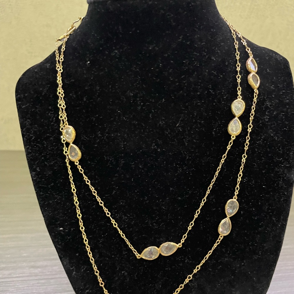 Doubled, long strand; may be worn singly.